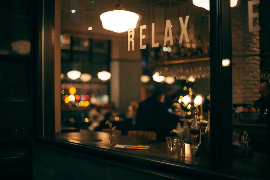 Suasana malam dalam kafe dengan cahaya hangat dan tulisan Relax di jendela